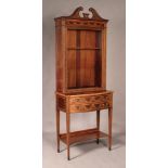 An Edwardian mahogany display cabinet-on-stand by Edwards & Roberts, with overall floral swag and