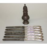 A late Victorian silver pepper caster, of spiral reeded baluster form with pierced dome cover,