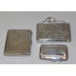 A George V silver cigarette case with overall foliate scroll engraved decoration, Birmingham 1913 by