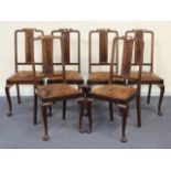 A set of six early 20th Century Queen Anne style mahogany splat back dining chairs with drop-in