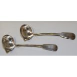 A pair of early Victorian Irish silver Fiddle pattern sauce ladles, each bowl with pouring lip,