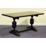 A mid-20th Century Jacobean Revival oak refectory table, the rectangular top on carved cup and cover