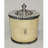 A mid-Victorian carved ivory and plate mounted tea caddy of oval section, the hinged lid with a