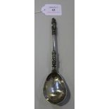 A 19th Century Chinese export silver spoon, the terminal with pierced crown, stiff leaf and beaded