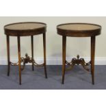 A pair of 20th Century satinwood oval occasional tables, the galleried tops above blind fretwork