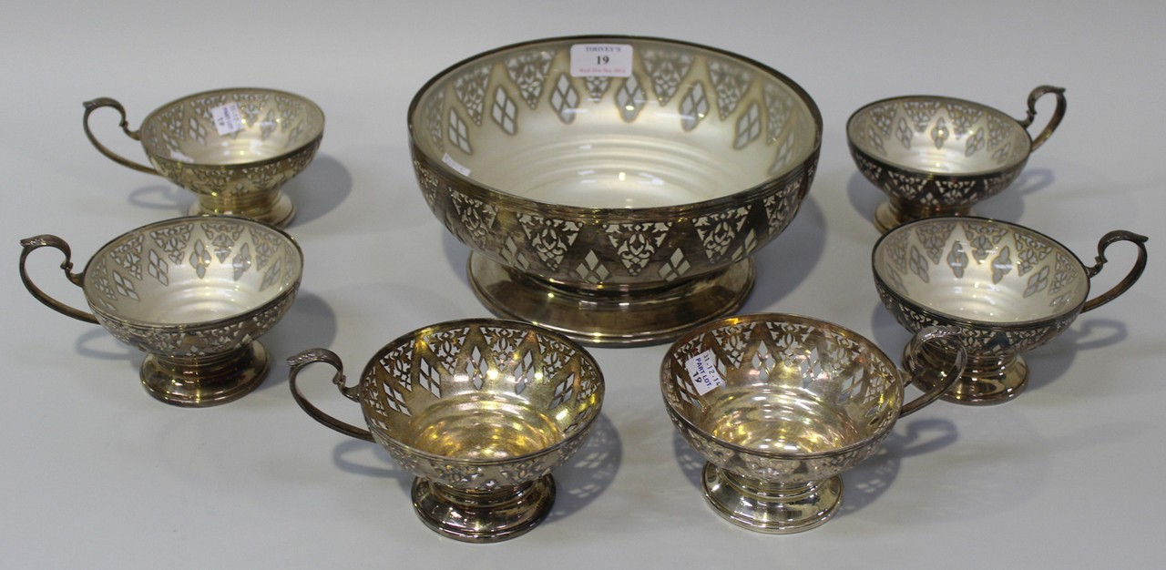 A Mappin & Webb plated dessert set with pierced foliate and diamond shaped decoration, comprising