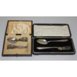 A George V silver child's pusher and spoon, Birmingham 1929, cased, and a silver christening spoon