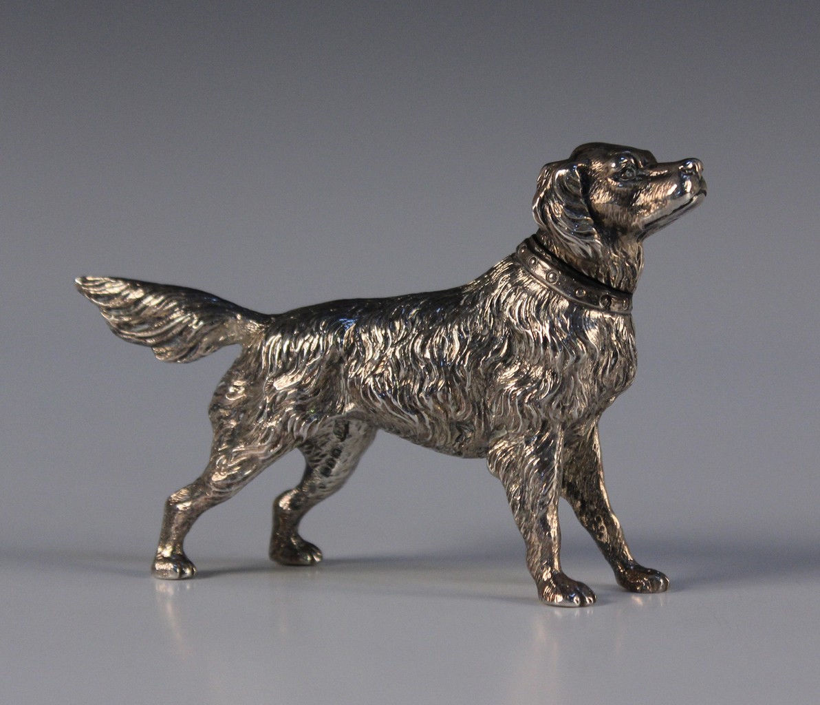 An Edwardian silver novelty pepper in the form of a retriever, London 1906 by William Edward