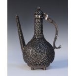 An Indian Mughal style white metal coffee pot with domed hinge lid, the baluster body finely