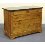 A 19th Century French cherry commode, the black marble top above four drawers, on shaped bracket