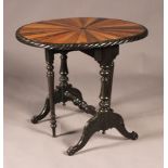 A late 19th Century Ceylonese ebony and specimen wood Sutherland table, the oval drop-flap top