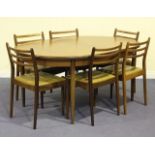 A G-Plan teak dining room suite, comprising an extending dining table, a set of six chairs and a