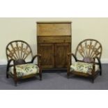 A pair of Art Deco bedroom armchairs with shaped backs and padded cushion seats, on turned supports,