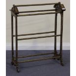 An early 20th Century Anglo-Indian walnut and bone inlaid towel rail, the ends with break arch tops,