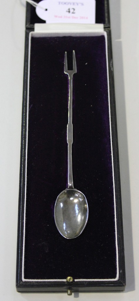 A silver sucket spoon and fork, probably late 17th Century, the flattened handle with a rat tail