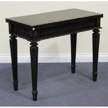 A 19th Century mahogany fold-over tea table, the rectangular top above a gadrooned frieze carved