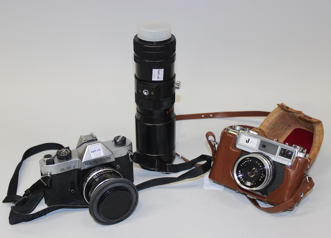 A Rolleiflex SL35 camera with Carl Zeiss Planar 1.8/50 lens, together with a Soligor auto-zoom 1:4.