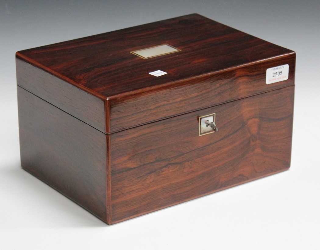 A Victorian rosewood box, the hinged lid and front with mother-of-pearl inlay, the compartmentalized