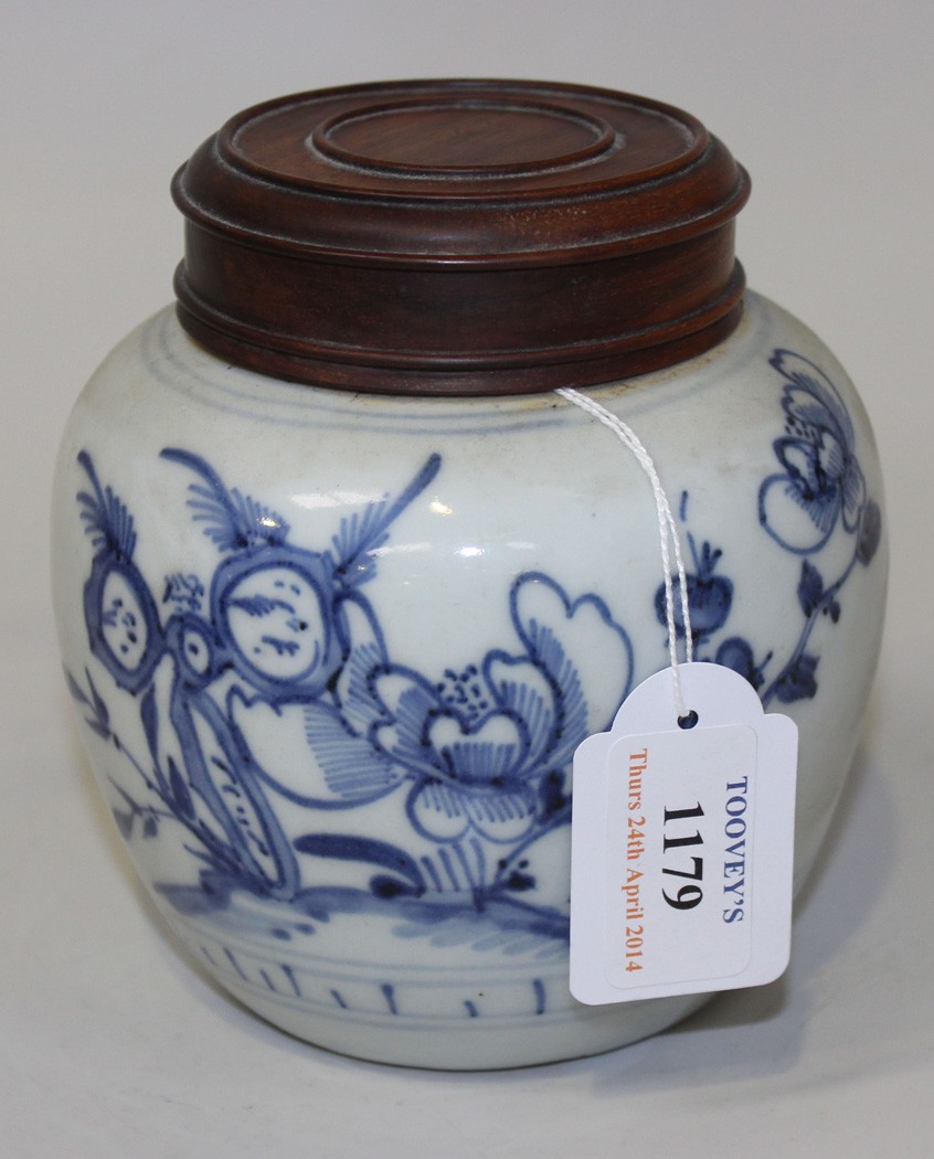 A Chinese blue and white porcelain jar, 18th Century, the stout ovoid body painted with peony and