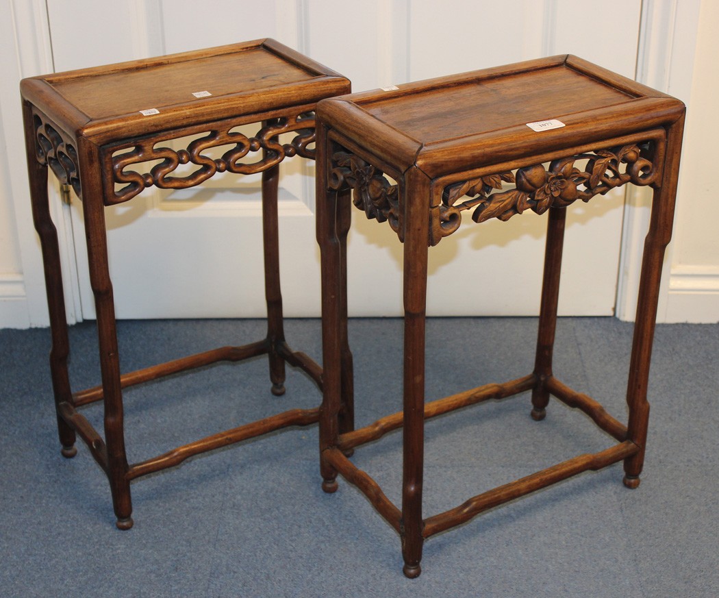 Two Chinese hardwood side tables, late 19th/early 20th Century, each rectangular panelled top on