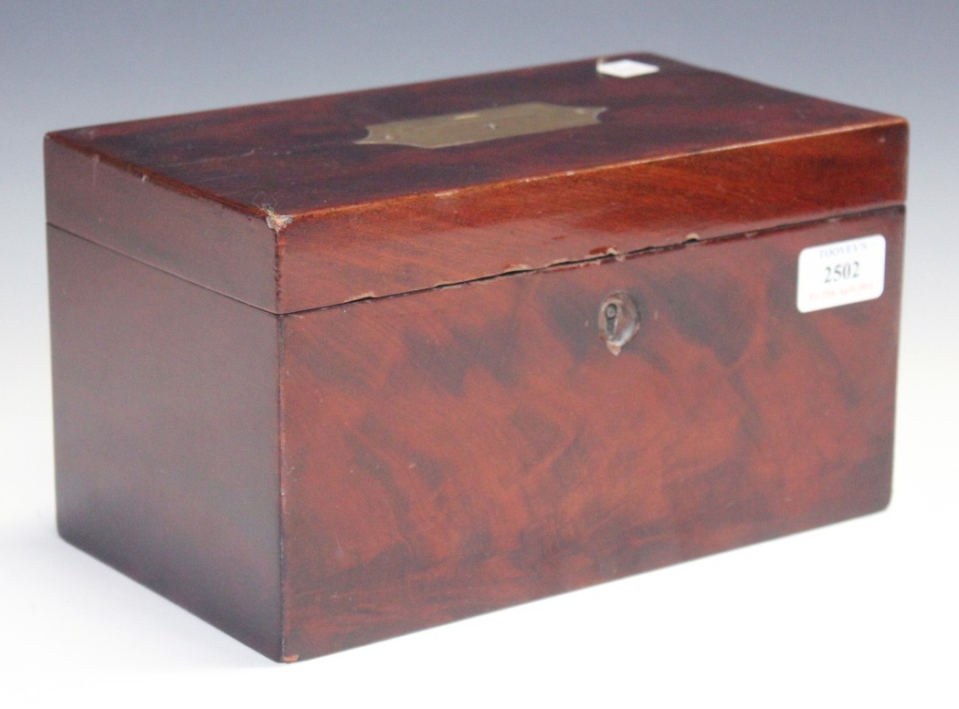 An early 19th Century figured mahogany tea caddy, the hinged lid with a recessed brass handle, the