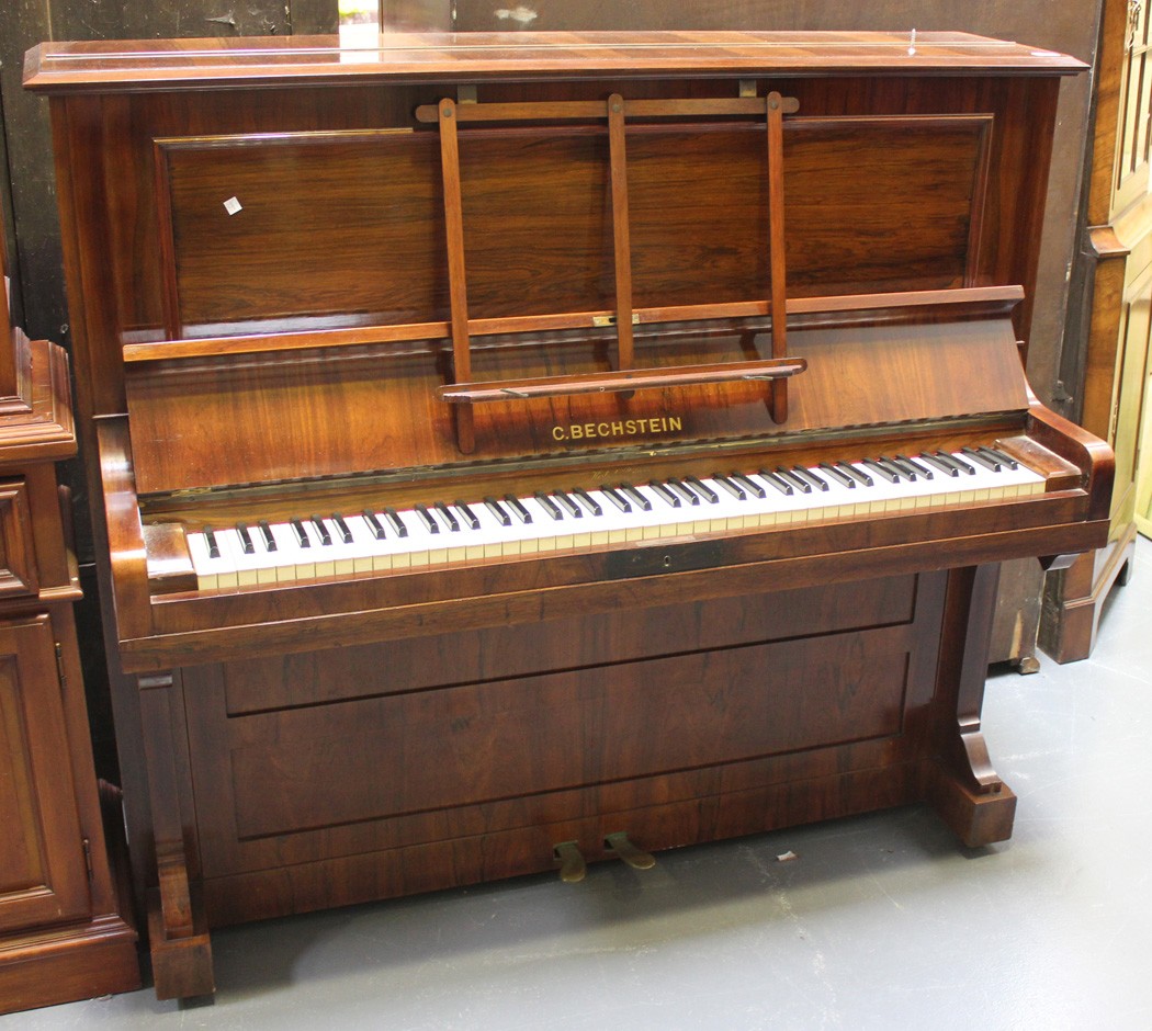 A late 19th Century rosewood cased upright piano by C. Bechstein, Berlin, the frame numbered `