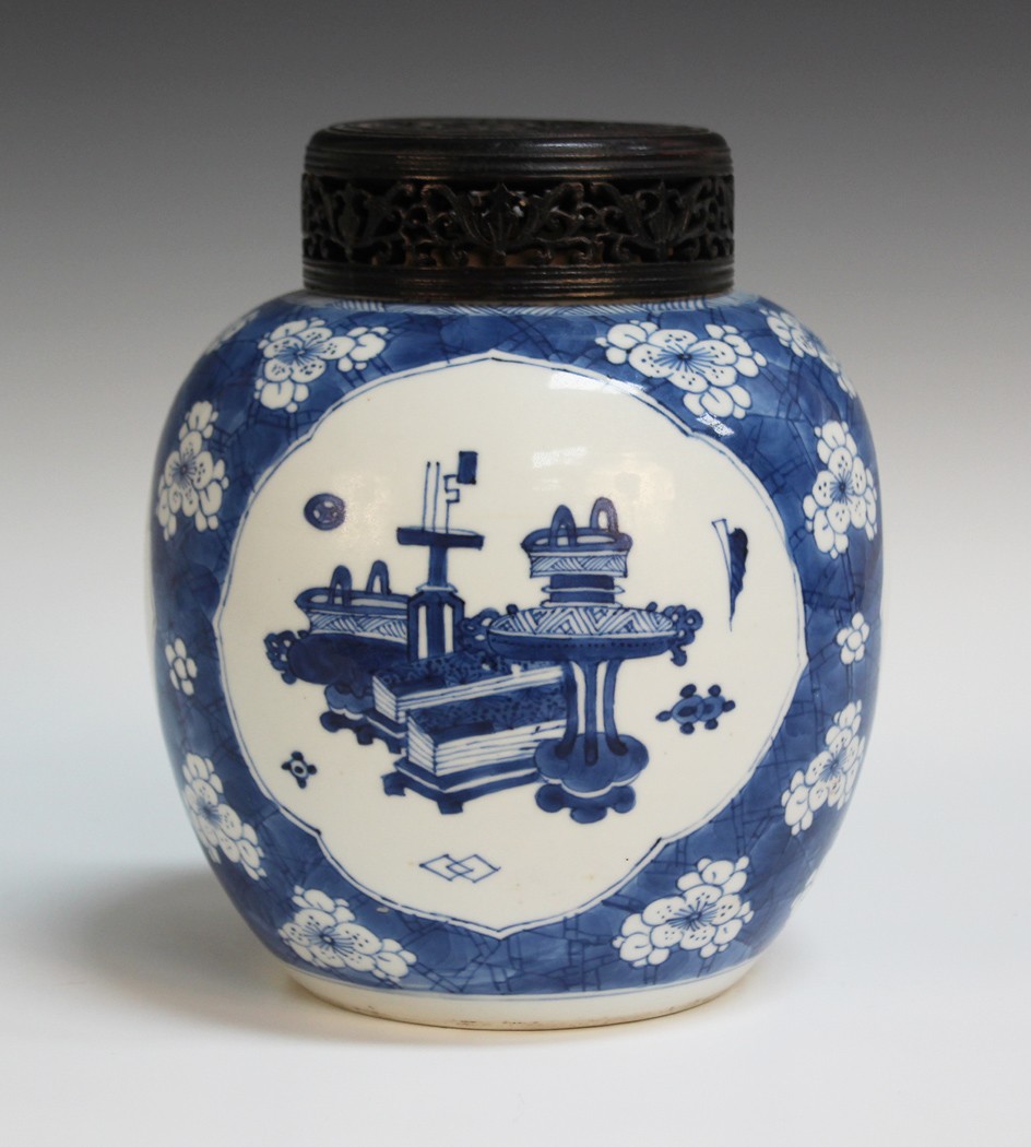 A Chinese blue and white porcelain ginger jar, 18th Century, the ovoid body painted with three