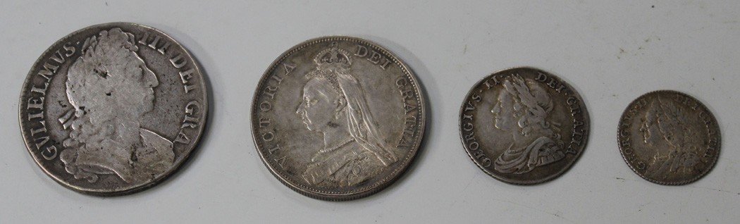 A William III crown 1696, a George II Young Head shilling 1735 roses and plumes, a George II Old