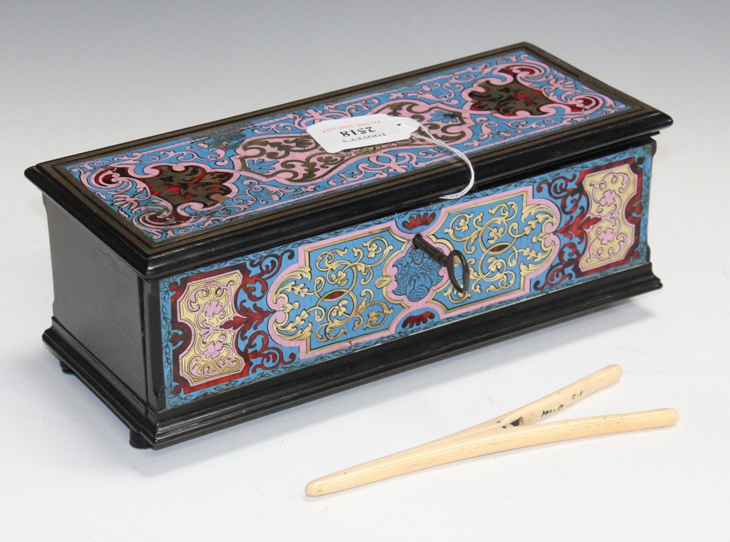 A mid-19th Century French polychrome boulle glove box, the hinged lid and drop front marquetry