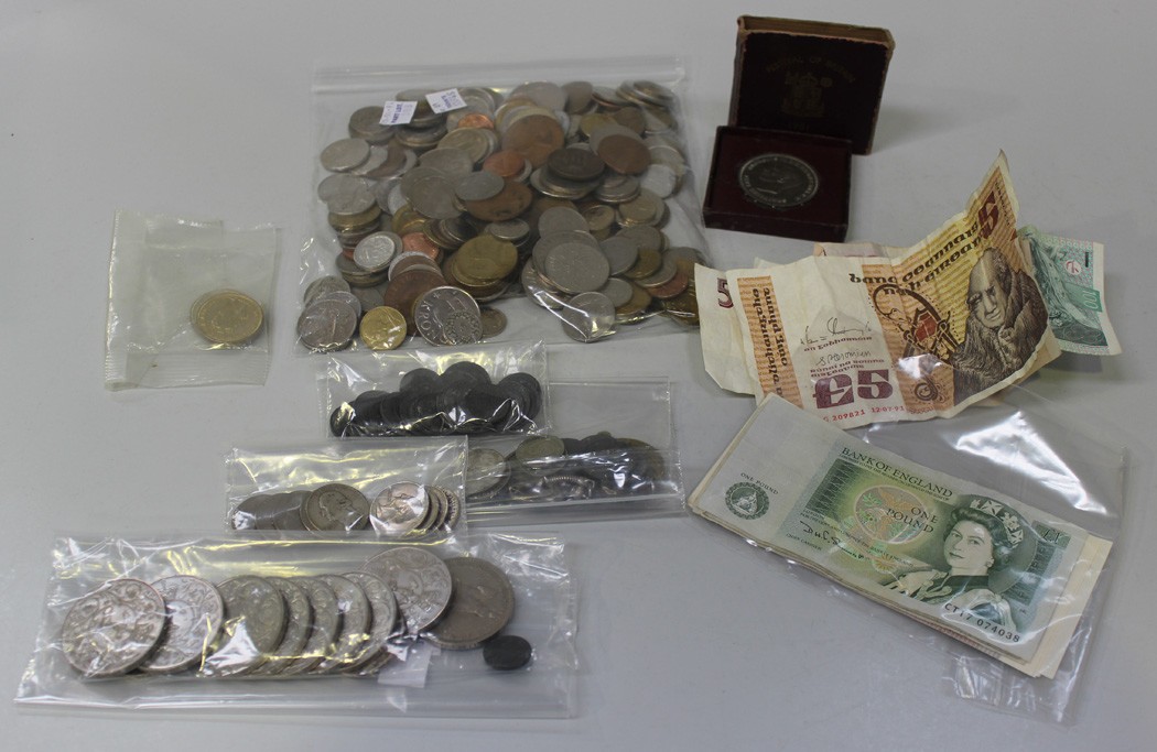 A quantity of British and foreign coins, including a William IV half-crown 1836, a Festival of