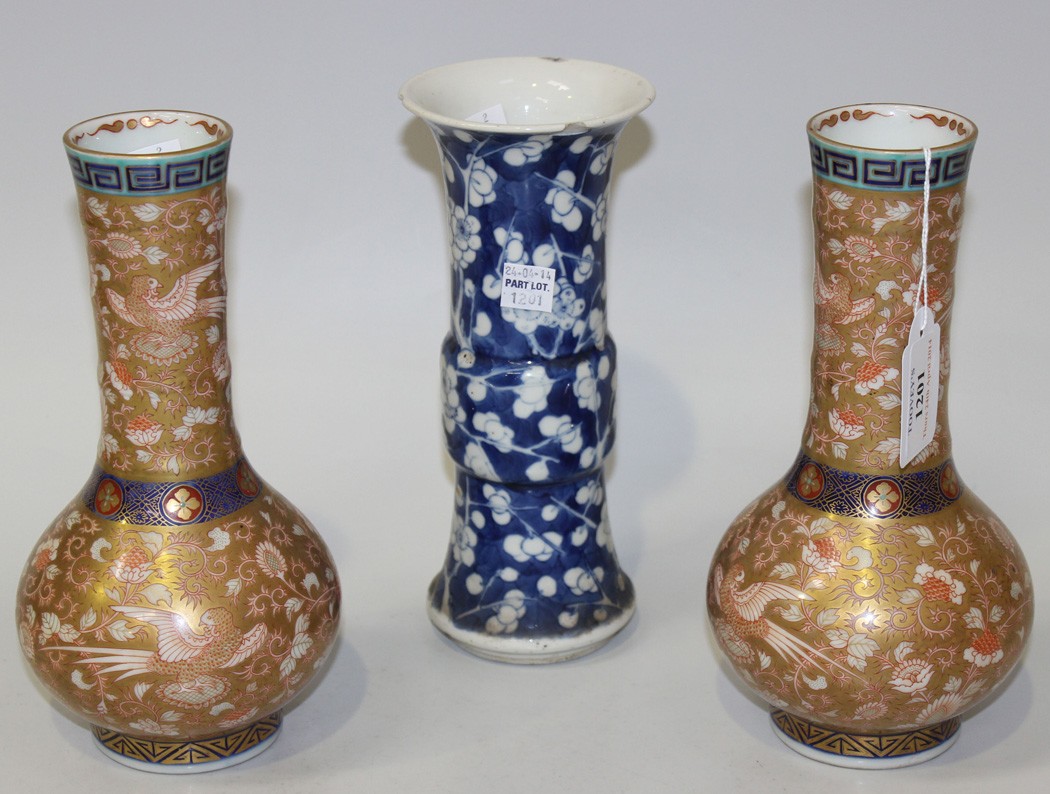 A pair of Japanese Fukagawa Koransha porcelain bottle vases, Meiji period, each ribbed cylindrical