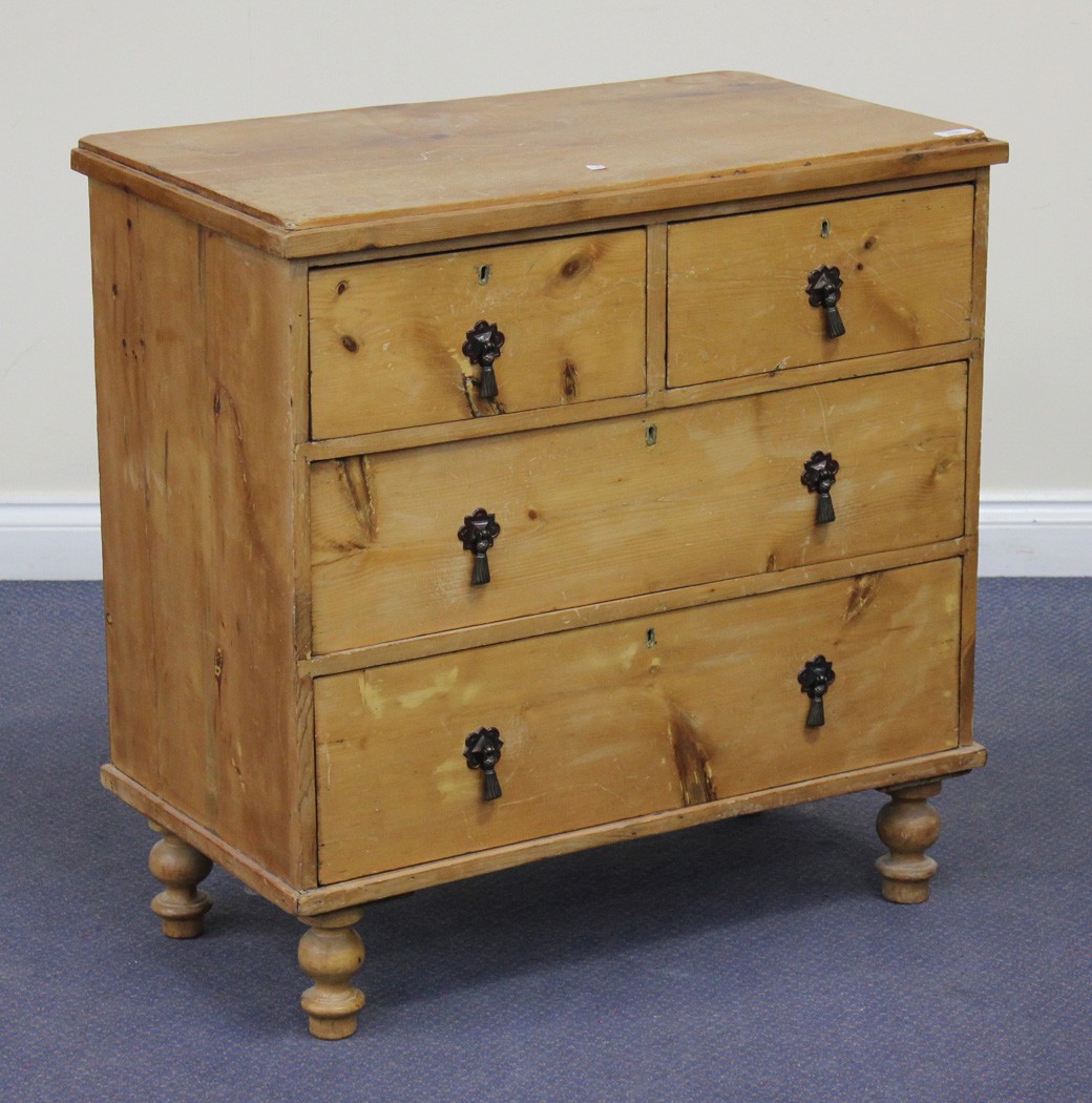 A Victorian stripped pine chest of two short and two long drawers, on turned feet, height approx