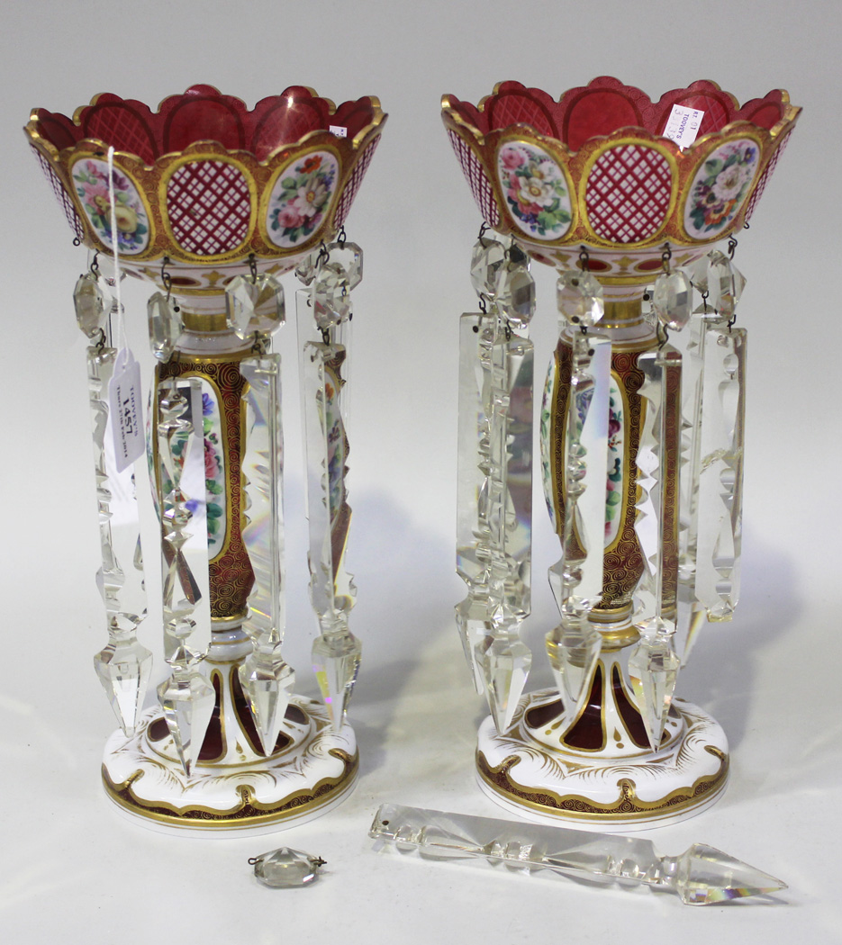 A pair of Bohemian cranberry glass and white flash overlay table lustres, late 19th Century, each