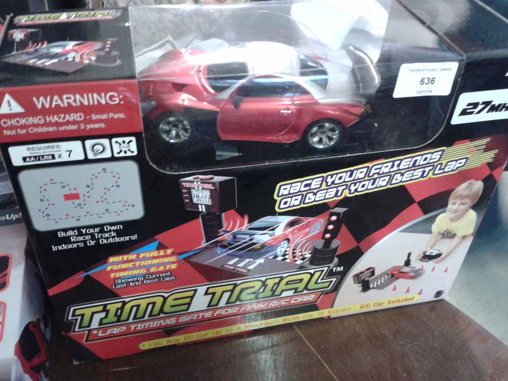 A boxed radio controlled car with time trial lap timing gate.