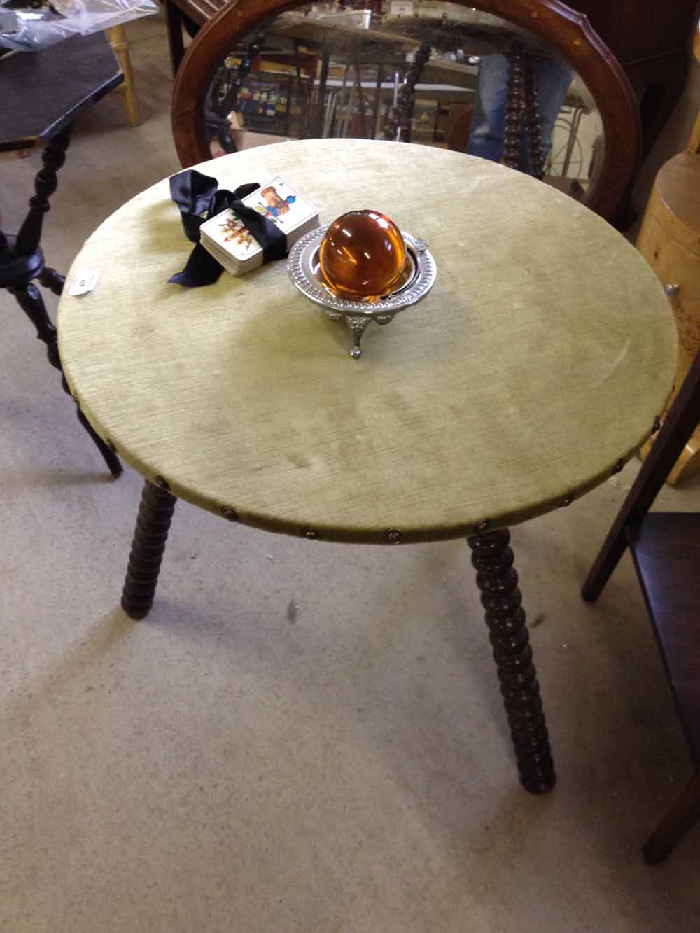 An authentic Gypsy fortune telling table with turned legs and green velvet top. With crystal ball