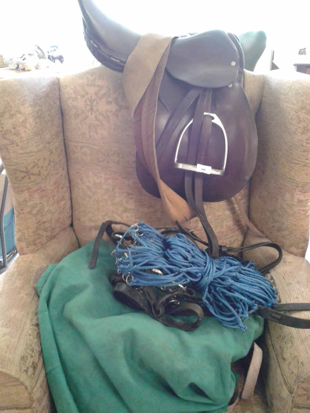 A collection of horse tack to include a saddle (approx 17""), a cob size bridle, a cob size New