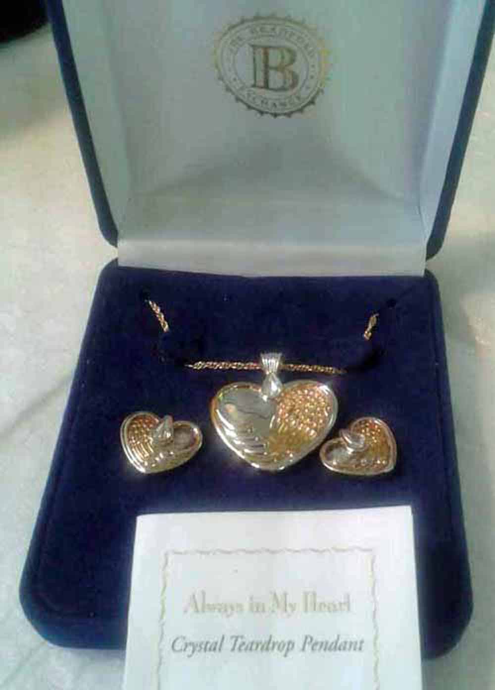 A Bradford Exchange 925 silver crystal teardrop & heart shaped necklace and earring set
