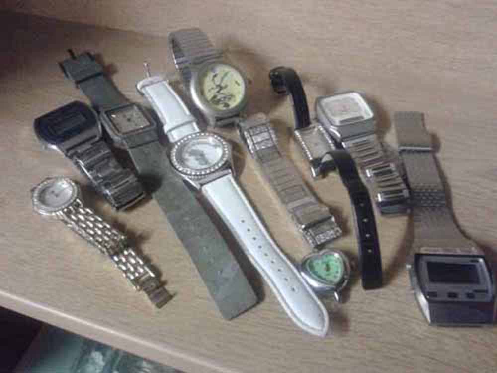 8 ladies and gents watches and a watch strap