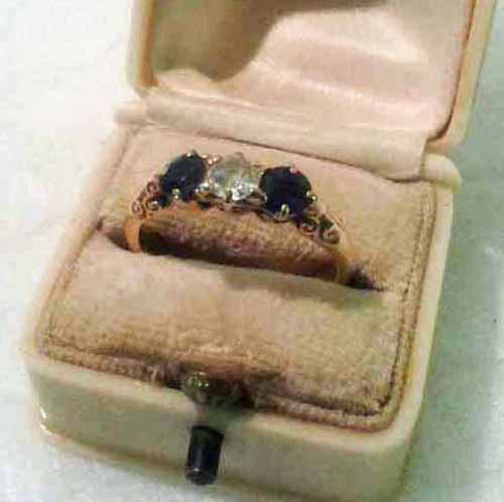 A heavy 18 carat gold 3 stone sapphire and diamond ring - each sone approx 0.25 carat size `P` ina