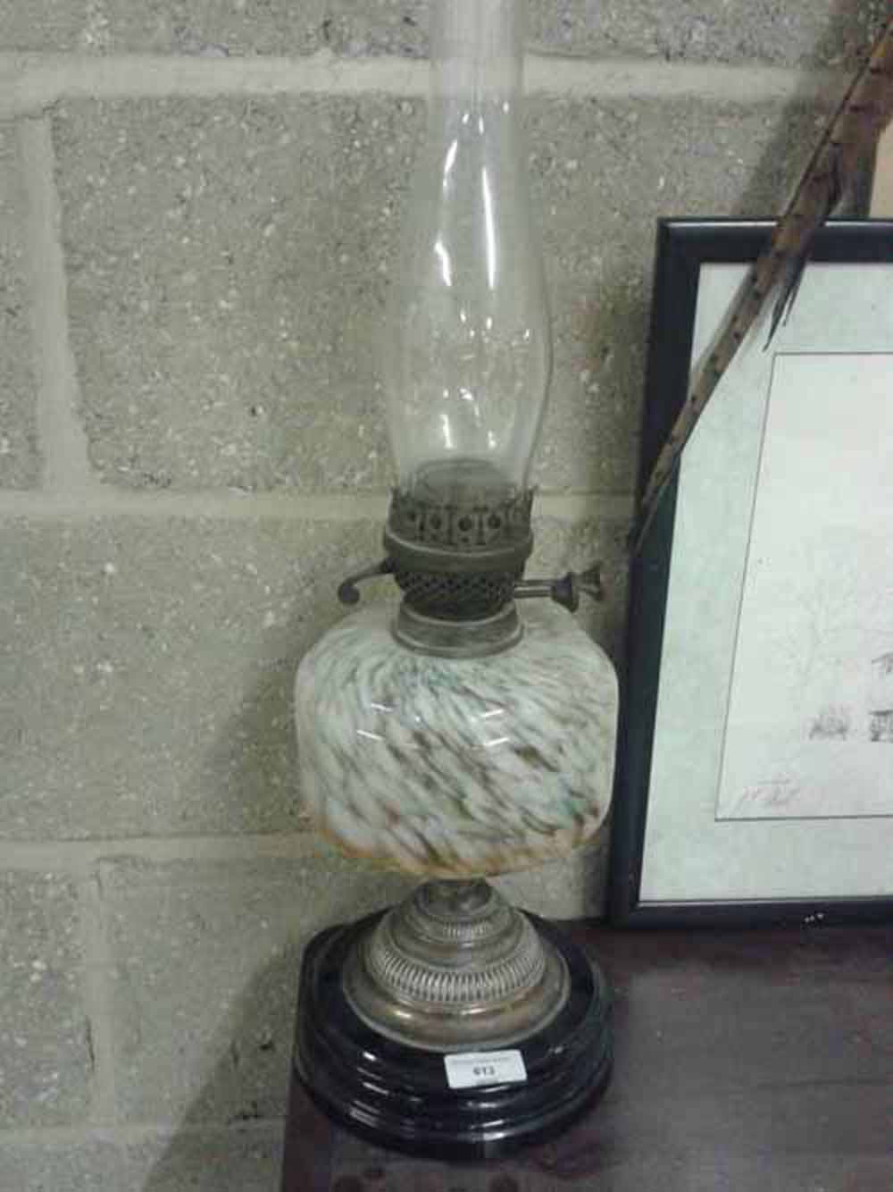 A Victorian/Edwardian oil lamp with mottled glass font - metal pedestal in need of straightening