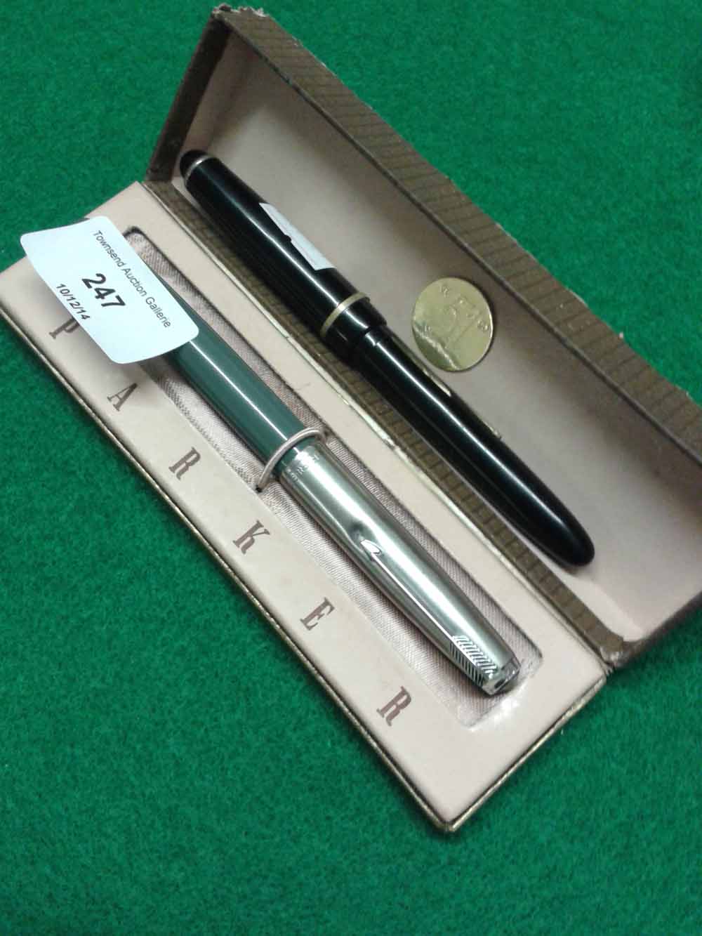 A boxed Parker 51 fountain pen with a black Osmiroid 65 fountain pen.