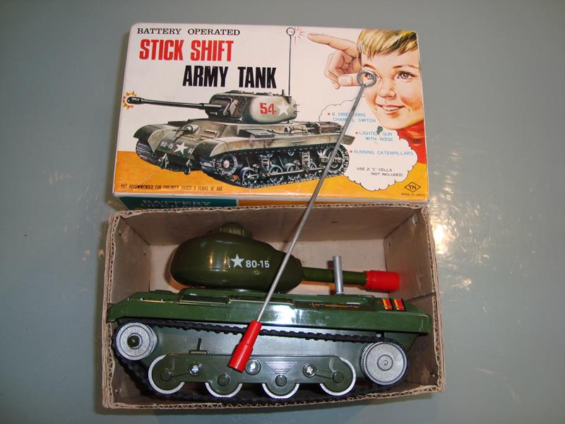 A Japanese 1960s battery operated stick shift army tank by Nomura in original box, some slight