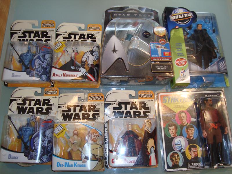 A tray containing a selection of mint boxed Star Wars Clone Wars action figures together with some