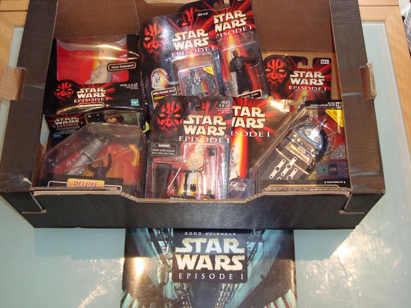 A tray containing a selection of mint boxed Star Wars Episode I action figures together with a