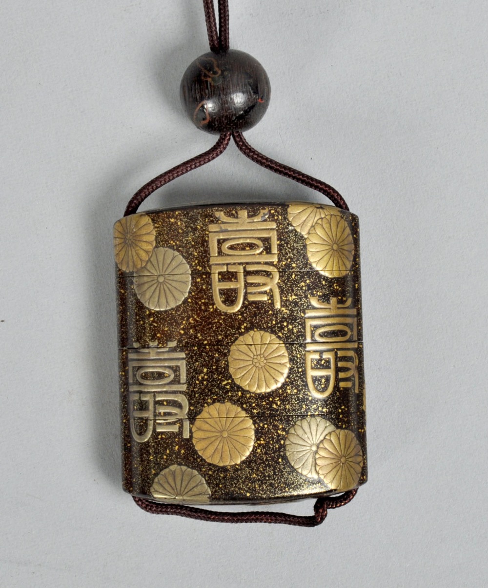 A Japanese four case gold lacquer inro, decorated with symbols and flowers, 2.5""w.