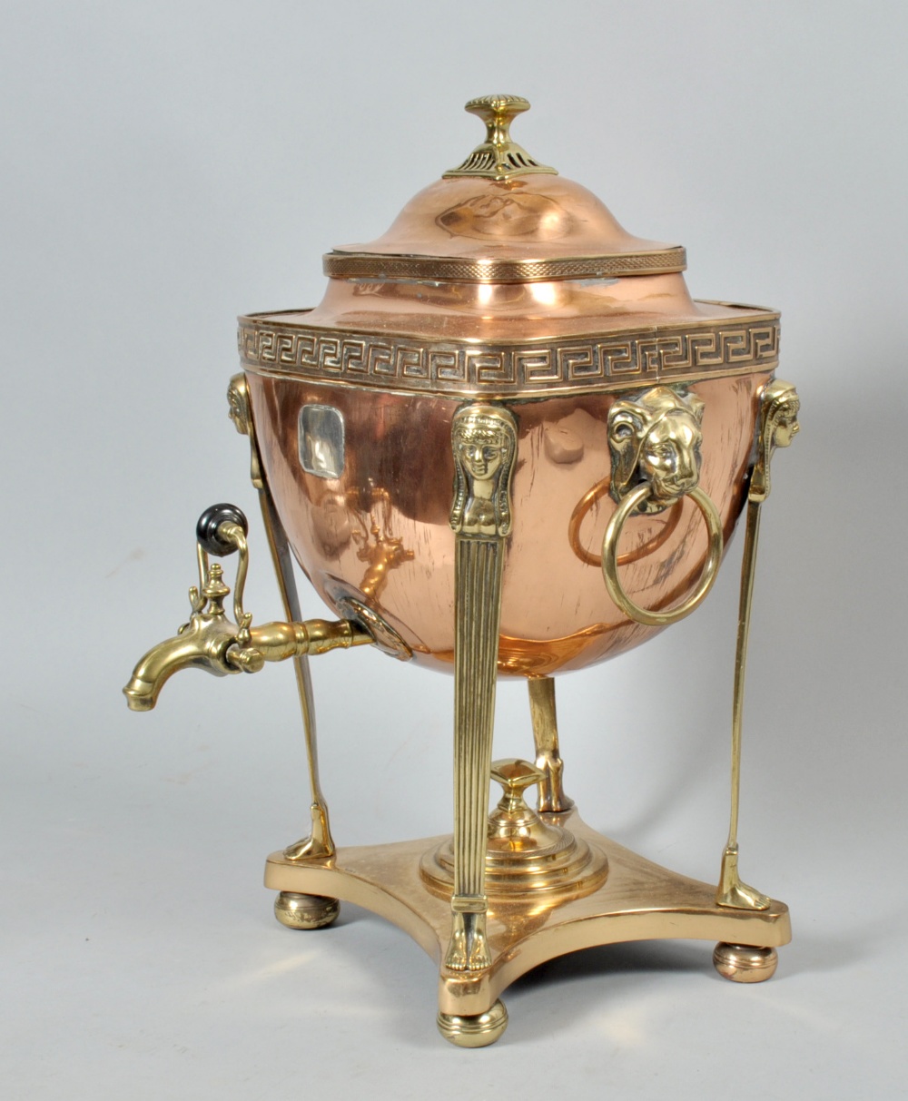 A Regency copper and brass samovar with lion mask ring pull handles and Egyptianesque supports,