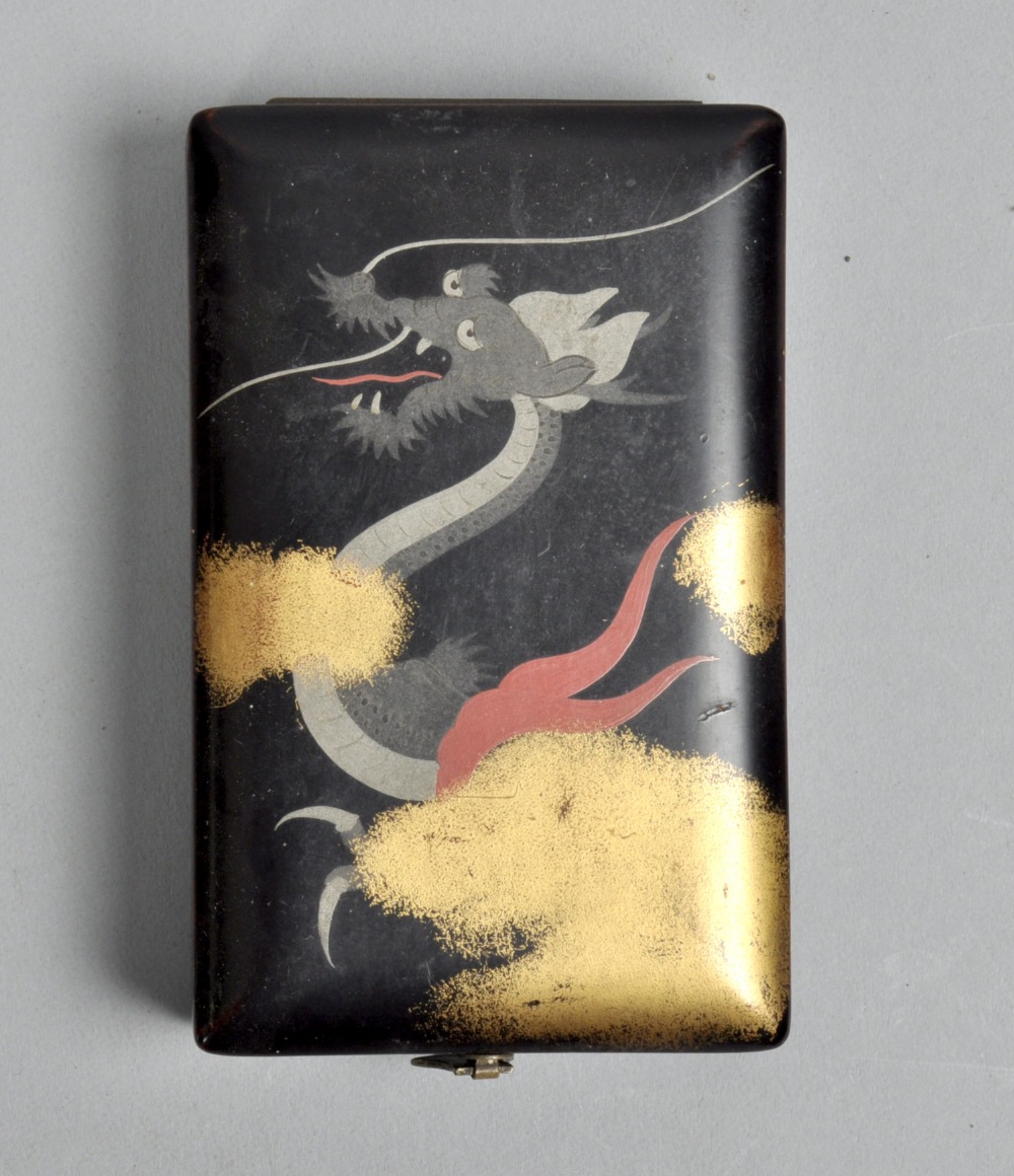 A Japanese black lacquered dragon painted box, hinged and with silk lined interior, 4""w.