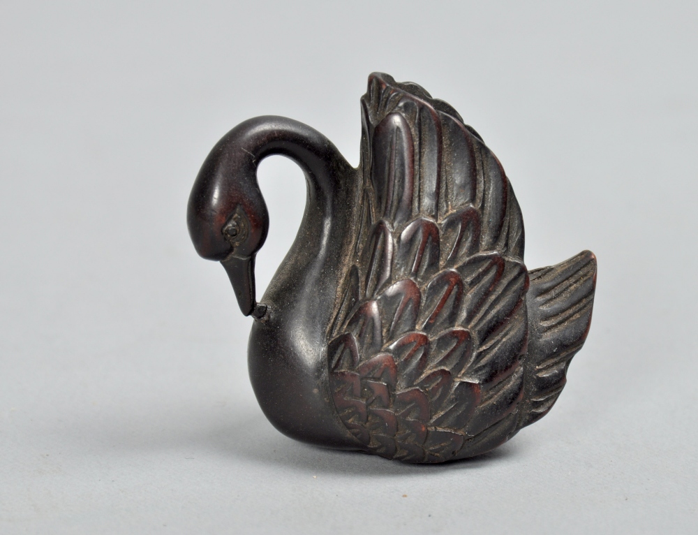 A Japanese wooden netsuke carved as a swan, base signed, 1.75""h.