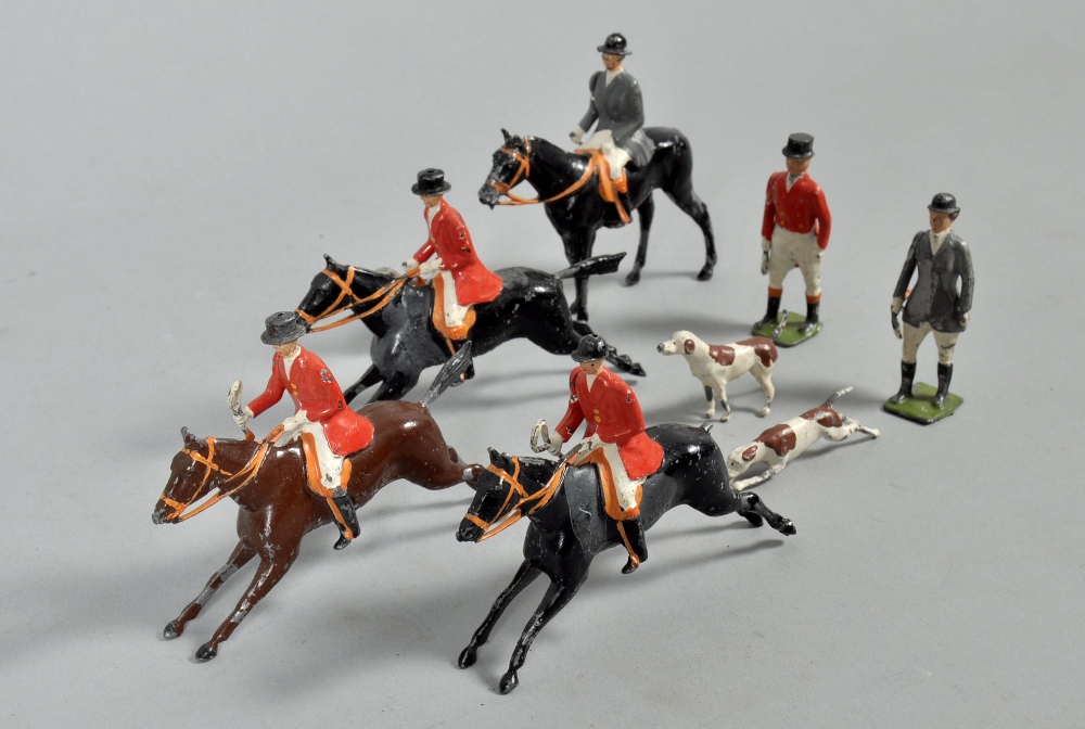 A Britains early 20c fox hunt comprising of eight huntsmen on horseback, four whipper in, nineteen