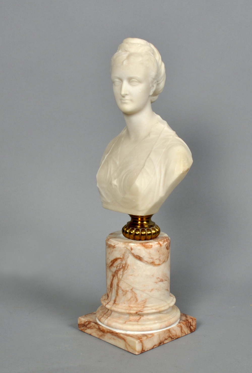 An alabaster sculpture of the honourable Mrs Lionel Ashley on a veined marble plinth, 15.75"" high